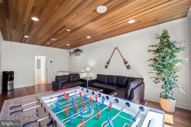 interior space featuring hardwood / wood-style flooring, ornamental molding, and wood ceiling