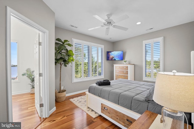 bedroom featuring ceiling fan and light hardwood / wood-style floors