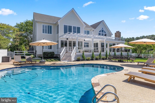 view of swimming pool with a pergola, a deck, and a patio