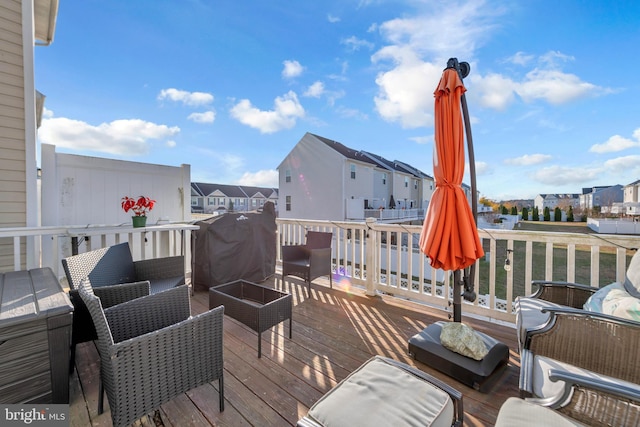 deck with an outdoor hangout area and a residential view