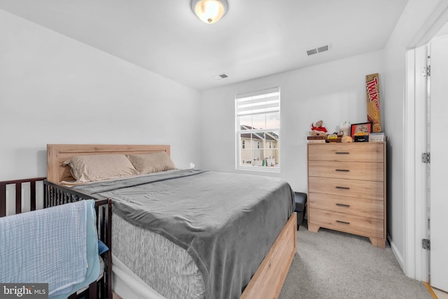 bedroom with carpet floors and visible vents