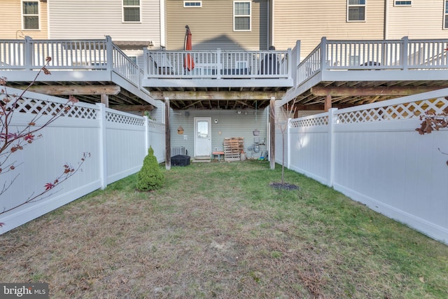 rear view of property featuring a yard, central AC, a fenced backyard, and a wooden deck