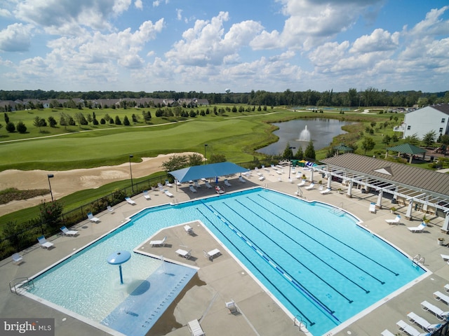 community pool with a patio area, golf course view, a water view, and fence