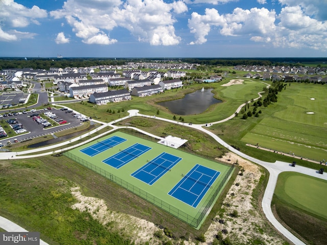 aerial view with a water view, a residential view, and golf course view