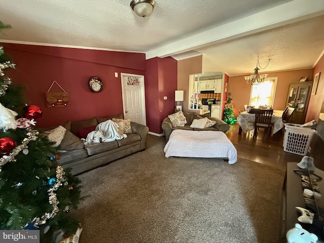 carpeted bedroom with a textured ceiling, vaulted ceiling with beams, and an inviting chandelier