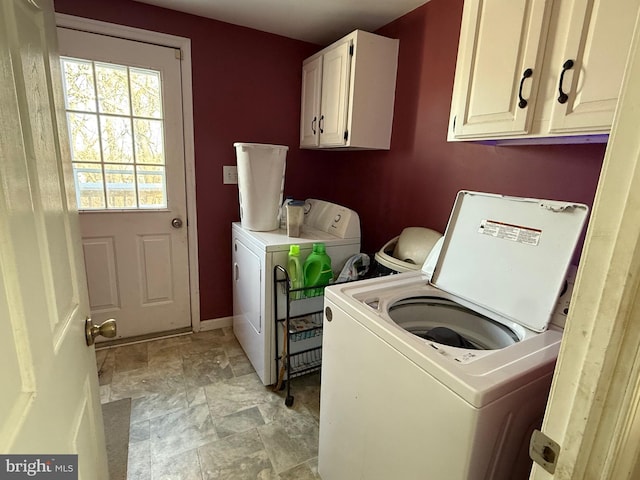 laundry area with cabinets and independent washer and dryer