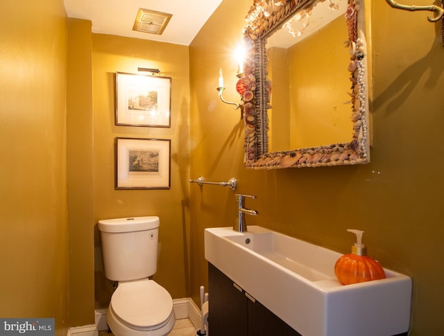 bathroom with tile patterned floors, sink, and toilet