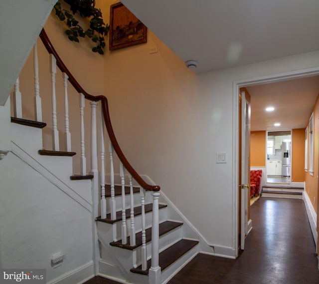 stairway with wood-type flooring