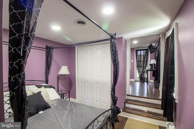 bedroom with a closet and wood-type flooring