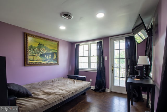 bedroom with dark wood-type flooring