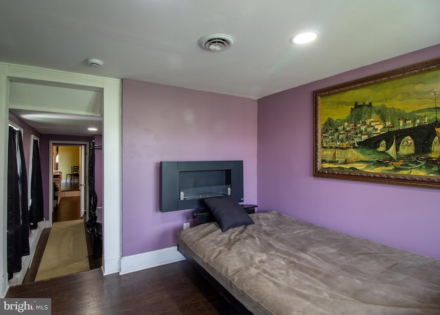 bedroom featuring dark wood-type flooring