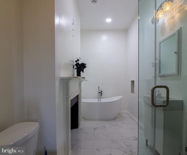 full bathroom featuring vanity, shower with separate bathtub, and toilet