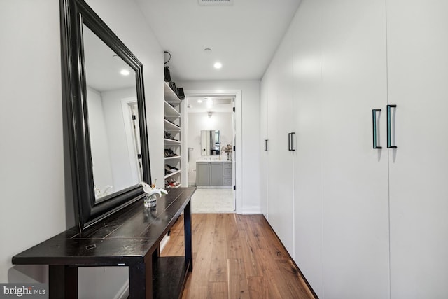 hall featuring wood-type flooring