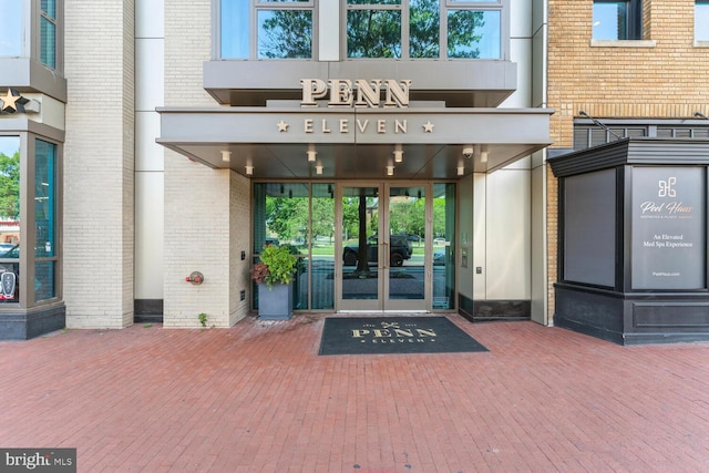 view of exterior entry featuring french doors