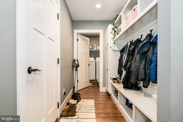 mudroom with dark wood-type flooring and independent washer and dryer