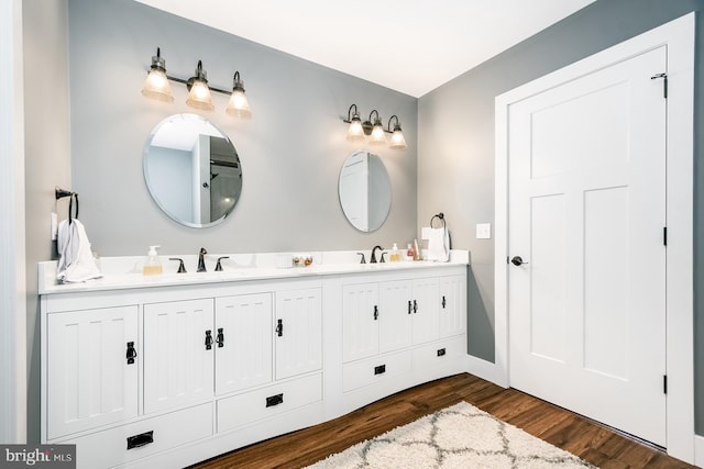 bathroom featuring hardwood / wood-style floors and vanity