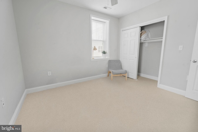 unfurnished bedroom with carpet floors and a closet