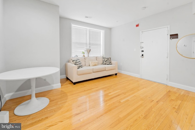 living room with light hardwood / wood-style floors