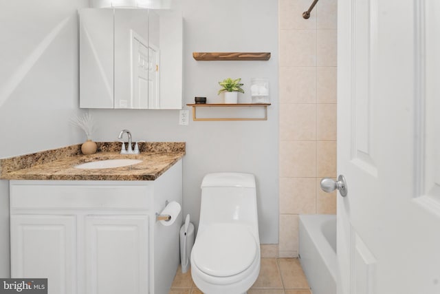 full bathroom with tile patterned flooring, vanity, toilet, and tiled shower / bath combo