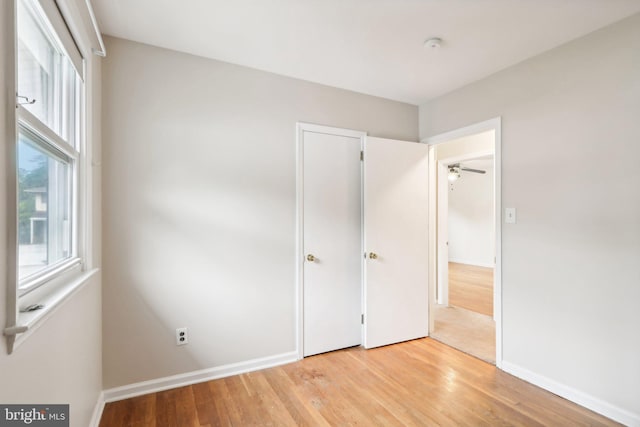 unfurnished bedroom featuring light wood-type flooring