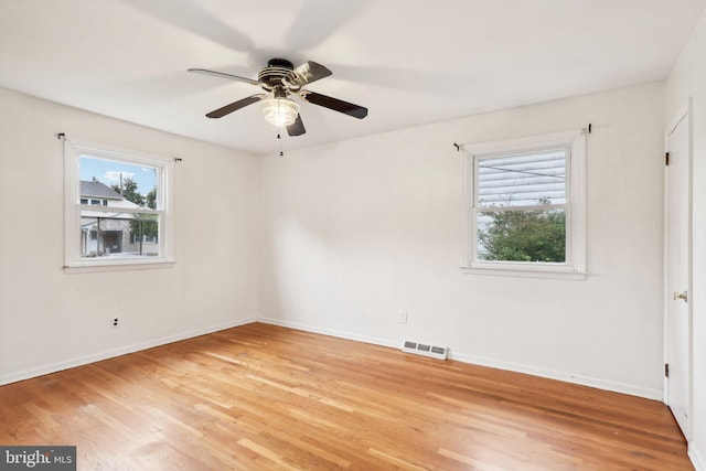 unfurnished room featuring light hardwood / wood-style flooring and ceiling fan