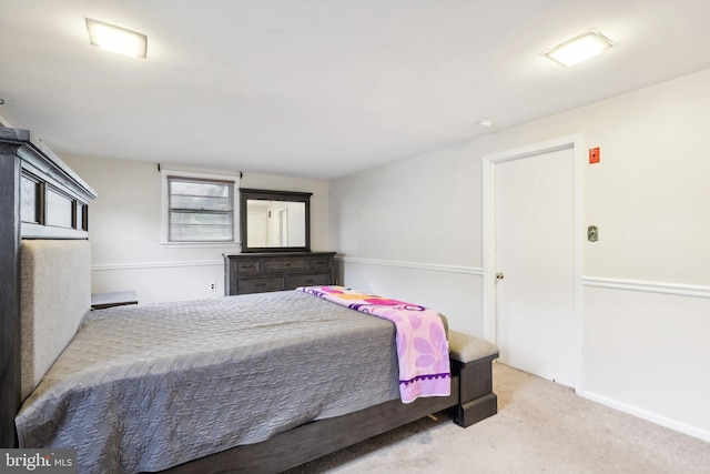 bedroom featuring light colored carpet