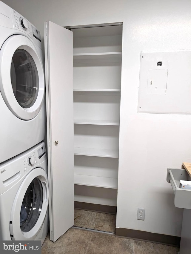 washroom with stacked washer and clothes dryer