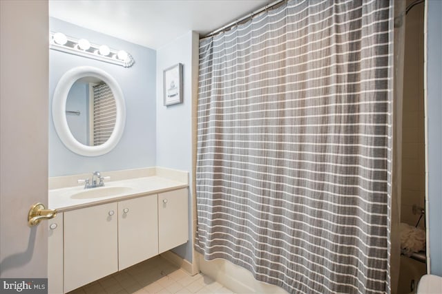 bathroom with vanity and shower / bath combination with curtain