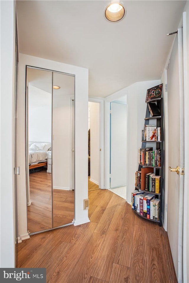 hall with light hardwood / wood-style floors