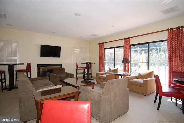 living room featuring light carpet