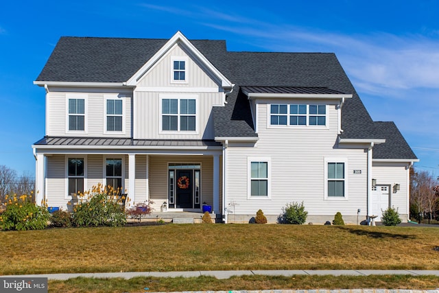 view of front of house featuring a front yard and a porch