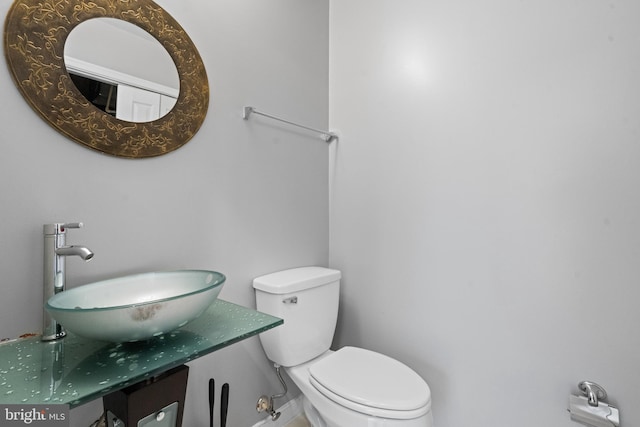 bathroom with sink and toilet