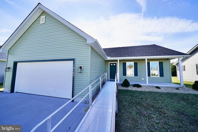 view of front of property with a front yard and a garage