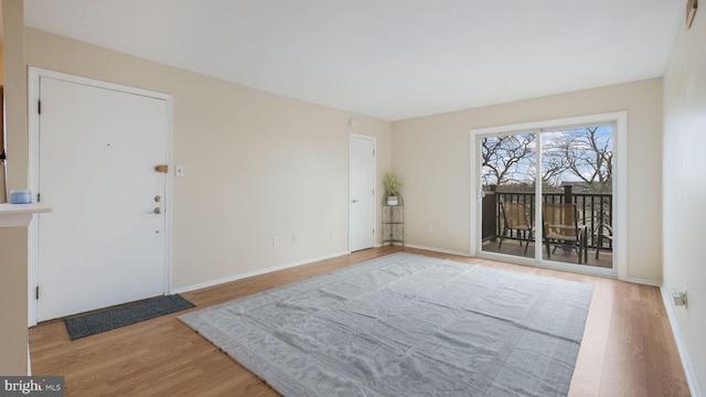 spare room with light hardwood / wood-style flooring