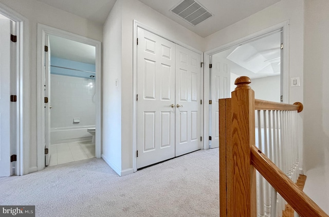 hallway with light carpet