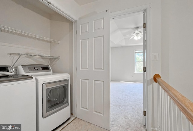 laundry room featuring light colored carpet, ceiling fan, and washing machine and clothes dryer