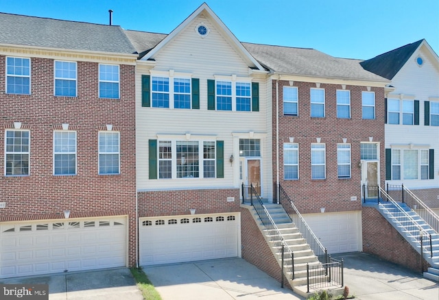 townhome / multi-family property featuring a garage