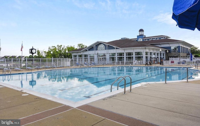 view of swimming pool with a patio