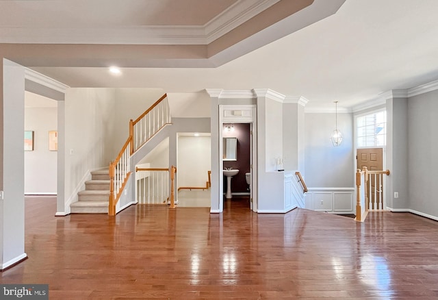 empty room with crown molding and dark hardwood / wood-style floors