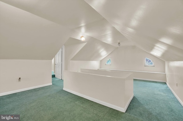 bonus room featuring carpet flooring and lofted ceiling