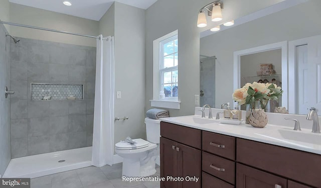 120 Forge Dr, Lebanon, PA 17042 - bathroom featuring tile patterned flooring, vanity, toilet, and tiled shower