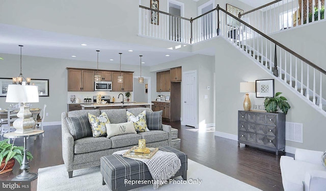 120 Forge Dr, Lebanon, PA 17042 - living room with dark hardwood / wood-style floors, sink, and a high ceiling