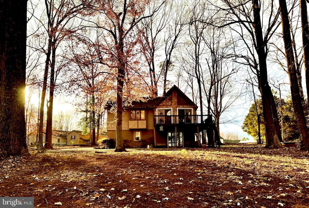 back of property featuring a deck