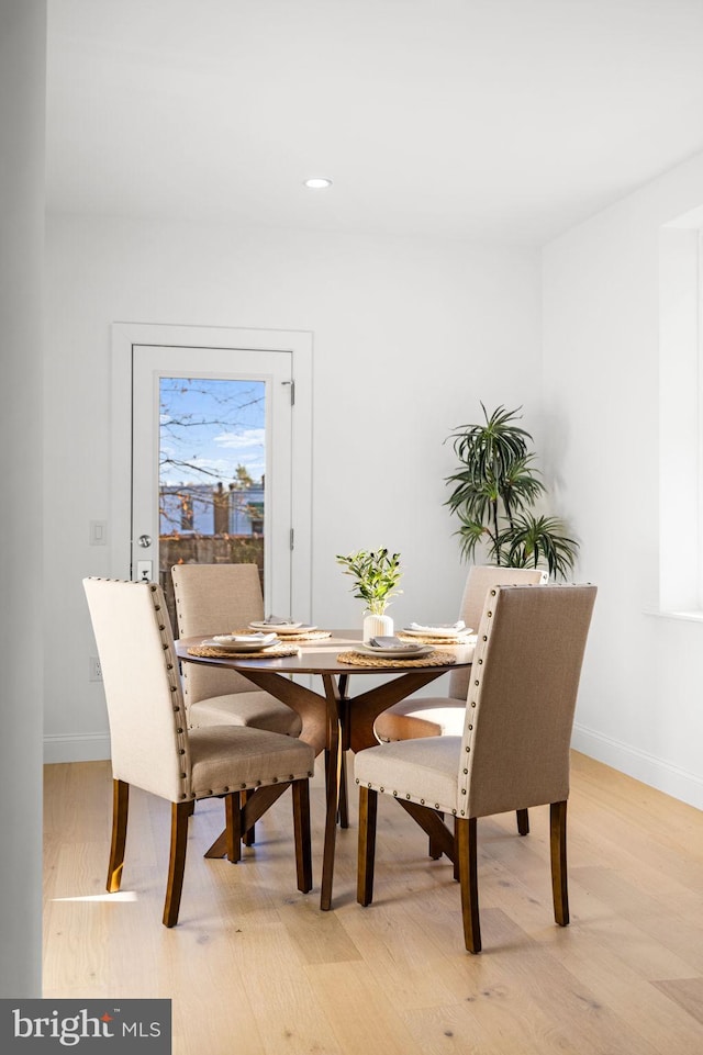 dining space with light wood-type flooring