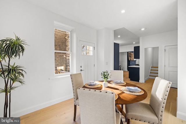 dining room with light wood-type flooring