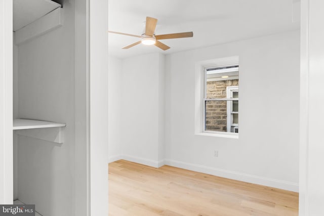 interior space with wood-type flooring and ceiling fan