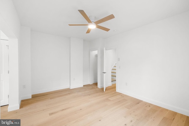 unfurnished bedroom featuring ceiling fan and light hardwood / wood-style floors