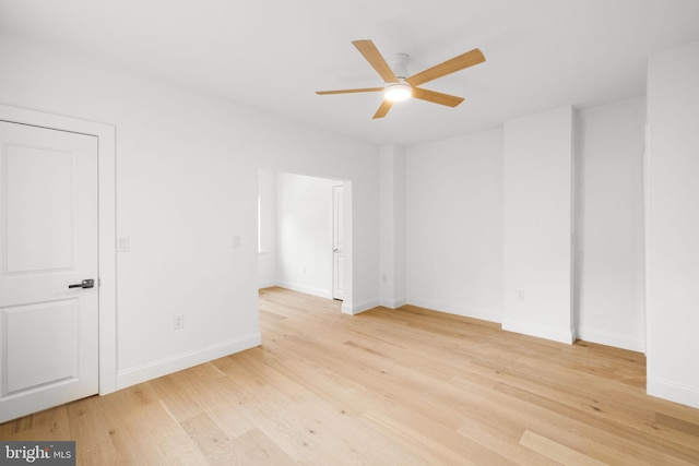 spare room with ceiling fan and light hardwood / wood-style floors