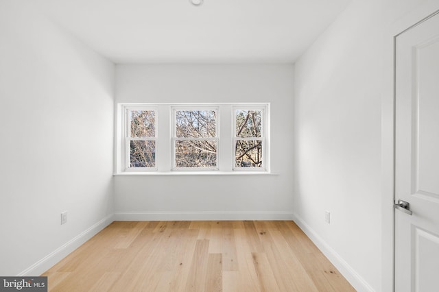 unfurnished room featuring light wood-type flooring