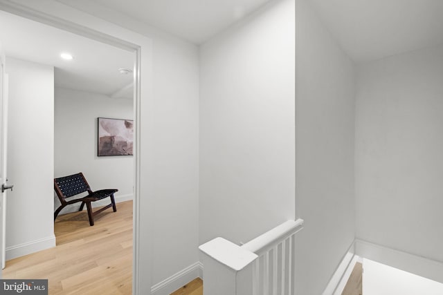 corridor featuring hardwood / wood-style flooring